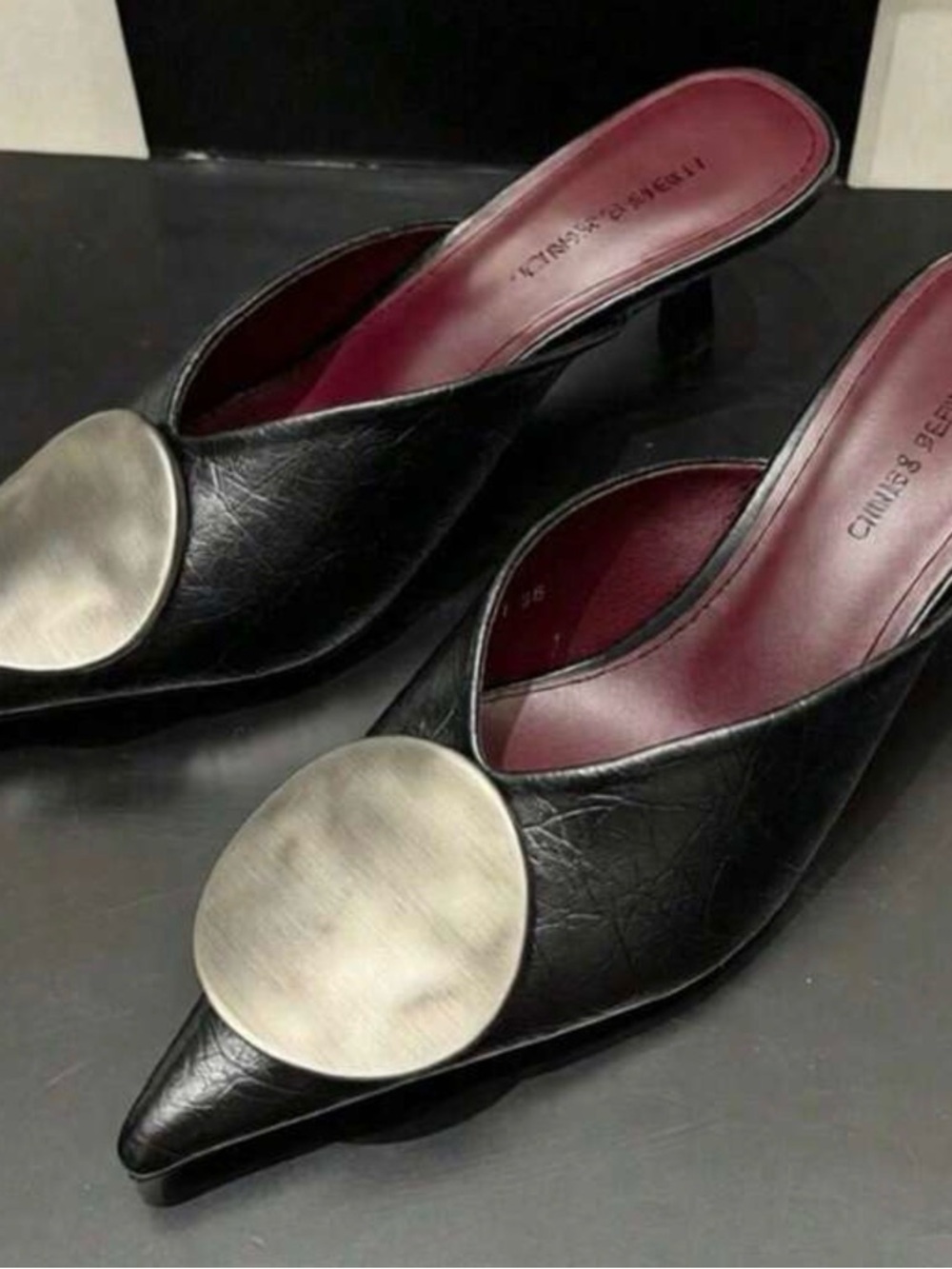 Charles & Keith Black Pointed Mule with Brushed Silver Disc
